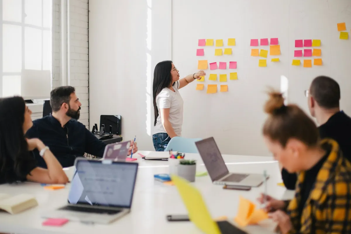 Management team discussing business operations in a meeting